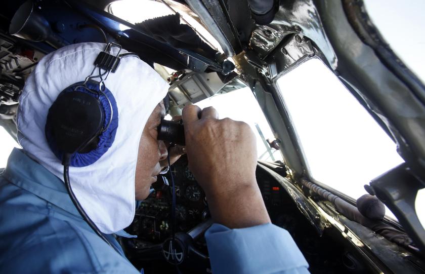 Deputy Commander of Vietnam 918 Air Brigade, Senior Lieutenant Nguyen Tri Thuc looks for the missing Malaysia Airlines flight MH370, that disappeared from radar screens in the early hours of Saturday, off Con Dao island March 12, 2014. — Reuters pic