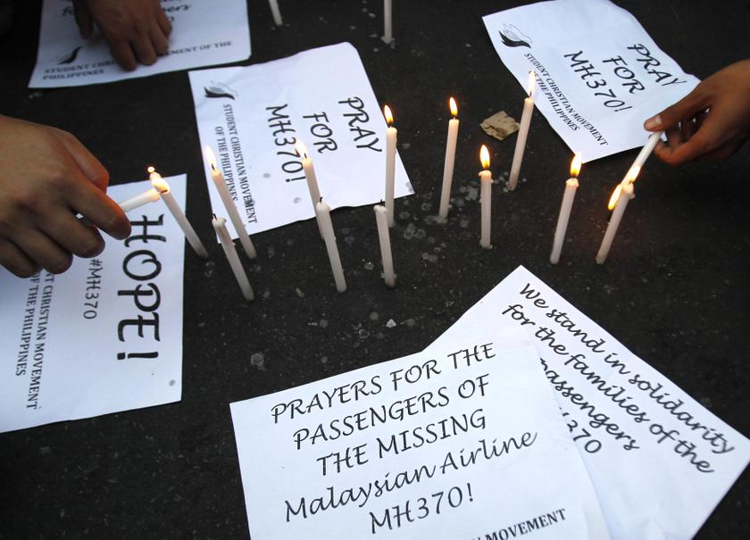 Students light candles during a vigil to show their support for the passengers of the missing Malaysia Airlines Flight MH370, in Manila March 13, 2014. u00e2u20acu201du00c2u00a0Reuters pic