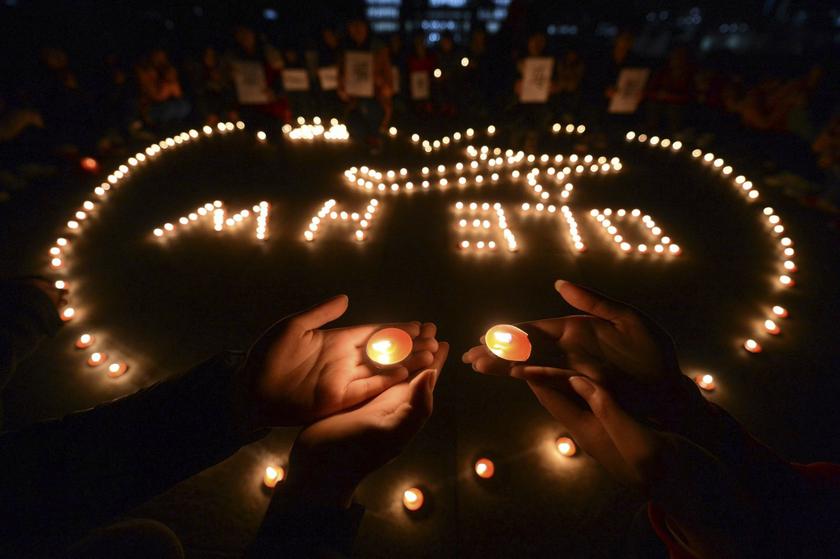 College students light up candles as they pray for passengers of the missing Malaysia Airlines MH370 plane in Yangzhou, Jiangsu province, March 13, 2014. u00e2u20acu201d Reuters pic