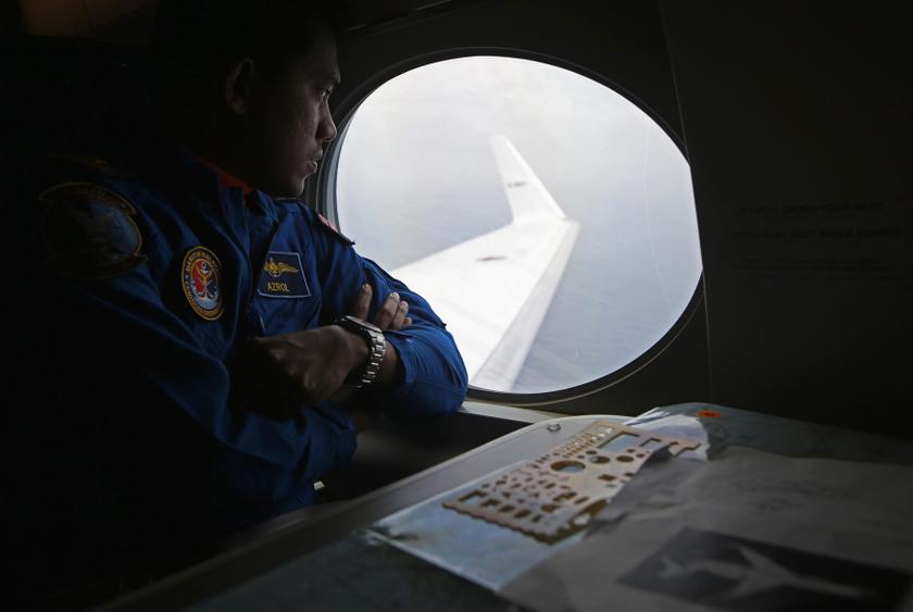 A Malaysia Maritime Enforcement Agency pilot looks out a window of Japan Coast Guard's Gulfstream V Jet aircraft over the waters of the South China Sea March 15, 2014.u00c2u00a0u00e2u20acu201d Reuters pic