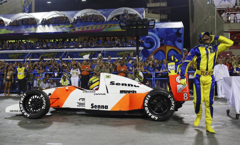 A mock Formula One car with the name of late Brazilian driver Ayrton Senna written on it is pushed as part of the Unidos da Tijuca samba school's presentation in the annual Carnival parade in Rio de Janeiro's Sambadrome, March 4, 2014. u00e2u20acu201d Reuters pic