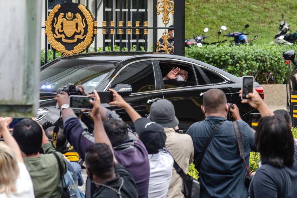 Datuk Seri Najib Razak waves at members of the press as he leaves Istana Negara in Kuala Lumpur August 19, 2021. u00e2u20acu201d Picture by Firdaus Latif