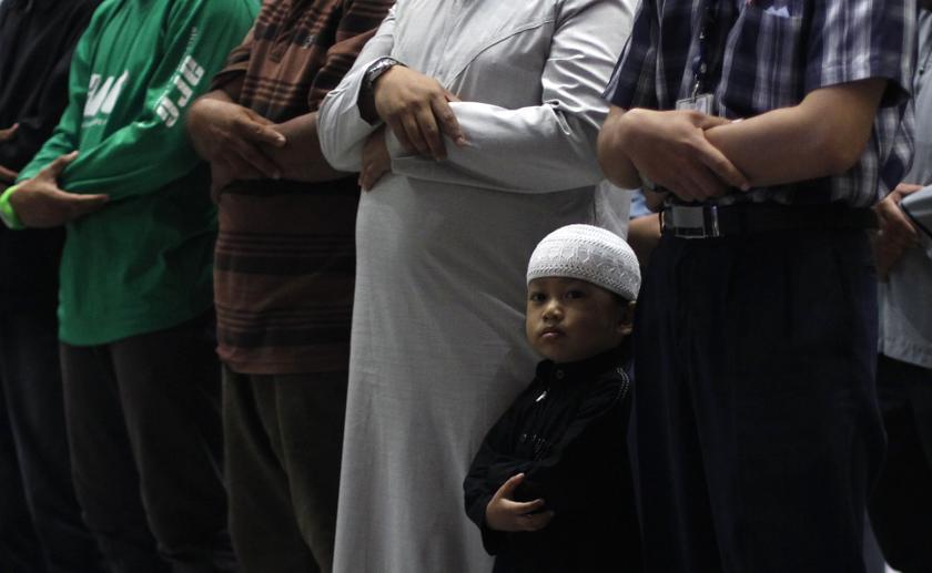 Muslims perform a special prayer for passengers of the missing Malaysia Airlines MH370 plane at the departure hall of the Kuala Lumpur International Airport March 13, 2014. u00e2u20acu201d Reuters pic