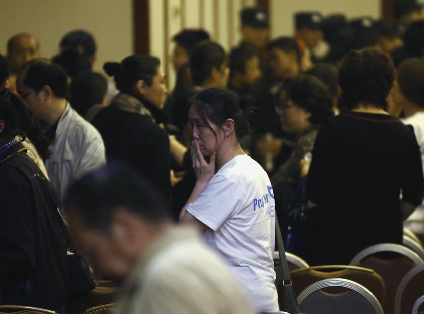 A relative of a passenger aboard Malaysia Airlines MH370 reacts as she leaves a room after a briefing by the Malaysian government, at the Lido Hotel in Beijing March 26, 2014. u00e2u20acu2022 Reuters picn