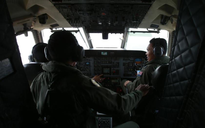 Royal Malaysian Air Force pilots work in the cockpit of a Malaysian Air Force CN235 aircraft during a Search and Rescue (SAR) operation to find the missing Malaysia Airlines flight MH370, in the Straits of Malacca March 13, 2014. u00e2u20acu201d Reuters pic