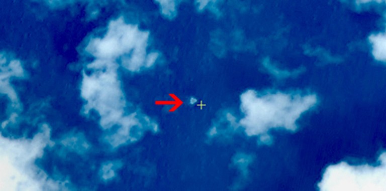 This handout photo provided on March 13, 2014 shows a satellite image taken from space, illustrating objects in a ,suspected crash sea area, in the South China Sea on March 9, 2014. u00e2u20acu201d AFP pic