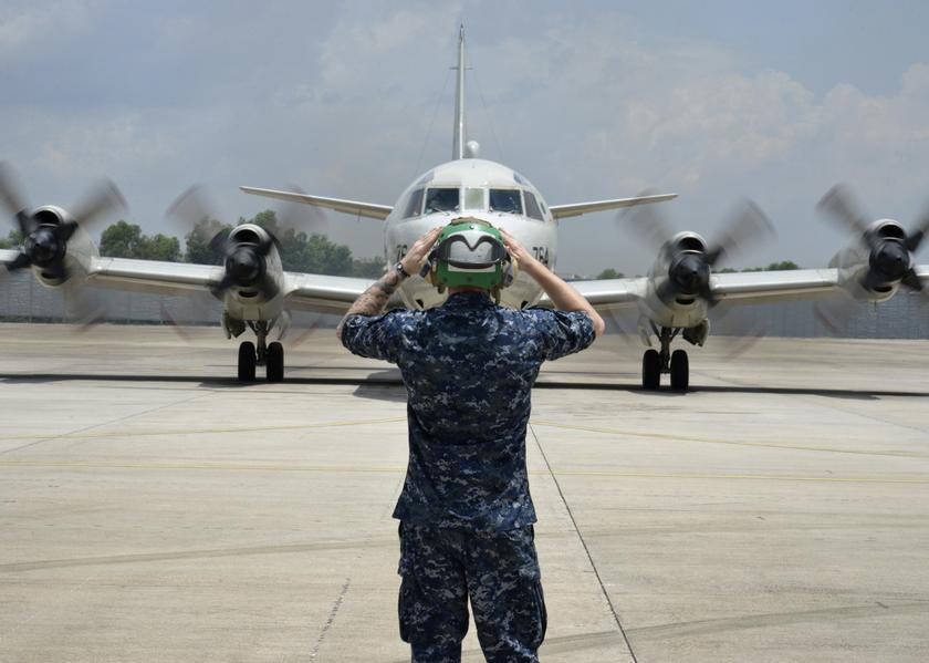 A sailor assigned to Patrol Squadron (VP) 46 prepares to launch a P-3C Orion before its mission to assist in search and rescue operations for missing Malaysia Airlines flight MH370 in Kuala Lumpur March 17, 2014, in this US Navy handout photo. Reuters pic