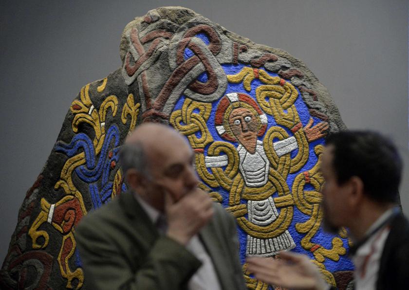 Visitors stand in front of a replica of King Harald Bluetoothu00e2u20acu2122s Danish rune stone, dating from the tenth century, at the British Museum in London March 4, 2014. u00e2u20acu201d Reuters pic