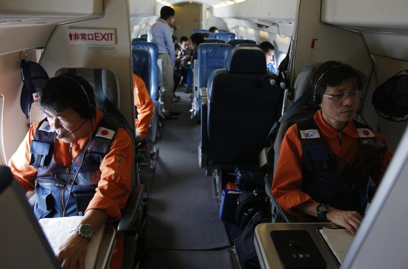 Japan Coast Guard personnel work in their Gulfstream V Jet aircraft, customized for search and rescue operations, as they search for the missing Malaysia Airlines MH370 plane over the waters of the South China Sea March 15, 2014. u00e2u20acu201du00c2u00a0Reuters pic
