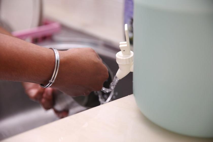  P. Krishna Vani stores water for washing in kitchen and bathroom. u00e2u20acu201d Picture by Choo Choy May 