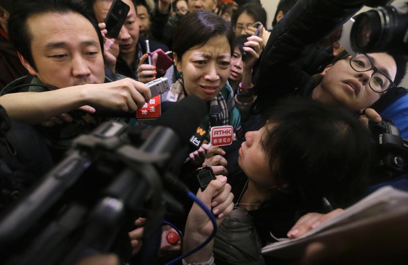 A woman, whose husband is a passenger of Malaysia Airlines flight MH370, complains about Malaysia Airlines to journalists as she attempts to leave a hotel in Beijing, March 8, 2014. u00e2u20acu201d Reuters pic