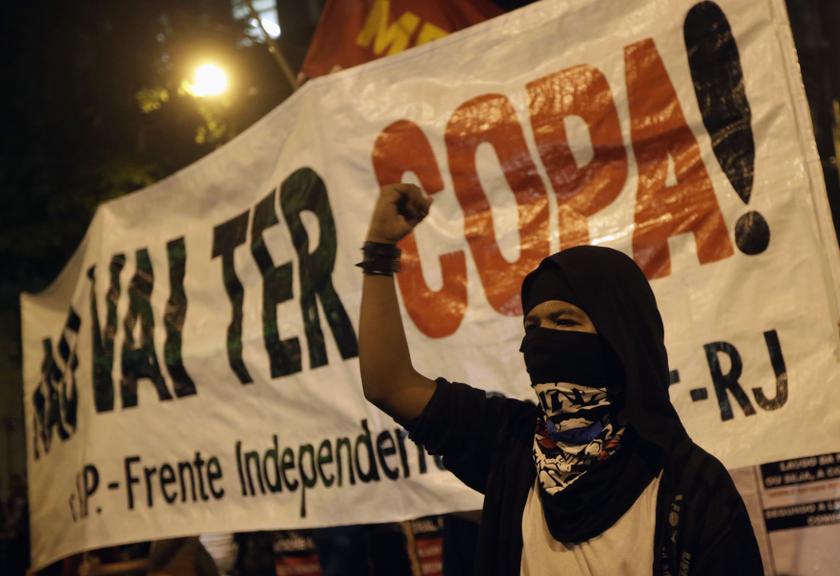 A masked demonstrator protests against the 2014 World Cup, in Rio de Janeiro March 12, 2014. u00e2u20acu2022 Reuters pic