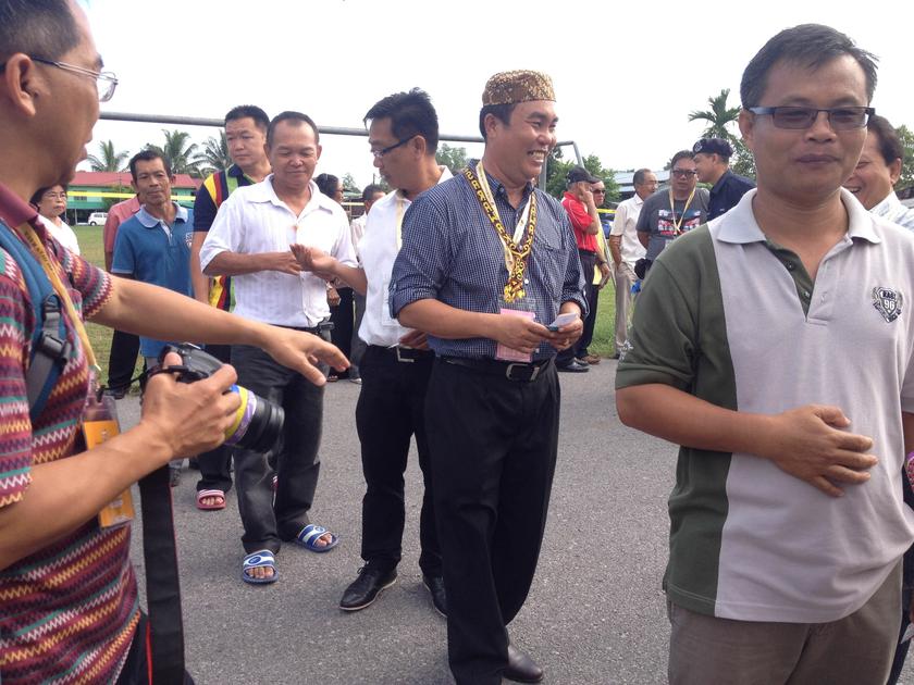Barisan Nasional candidate Yussibnosh Balo joining the queue with the people at the Kpg Tellian Tengah multi-purpose hall. u00e2u20acu2022 Picture by Nigel Edgar