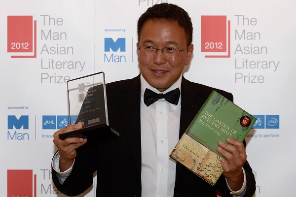 Malaysian author Tan Twan Eng poses after winning the Man Asian Literary Prize for his novel 'The Garden of Evening Mists'. u00e2u20acu201d AFP pic