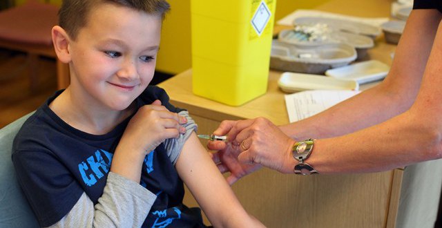 Luke Tanner, 7, receives the combined Measles Mumps and Rubella (MMR) vaccination at a drop-in clinic at Neath Port Talbot Hospital near Swansea in south Wales on April 20, 2013. u00e2u20acu201d AFP pic