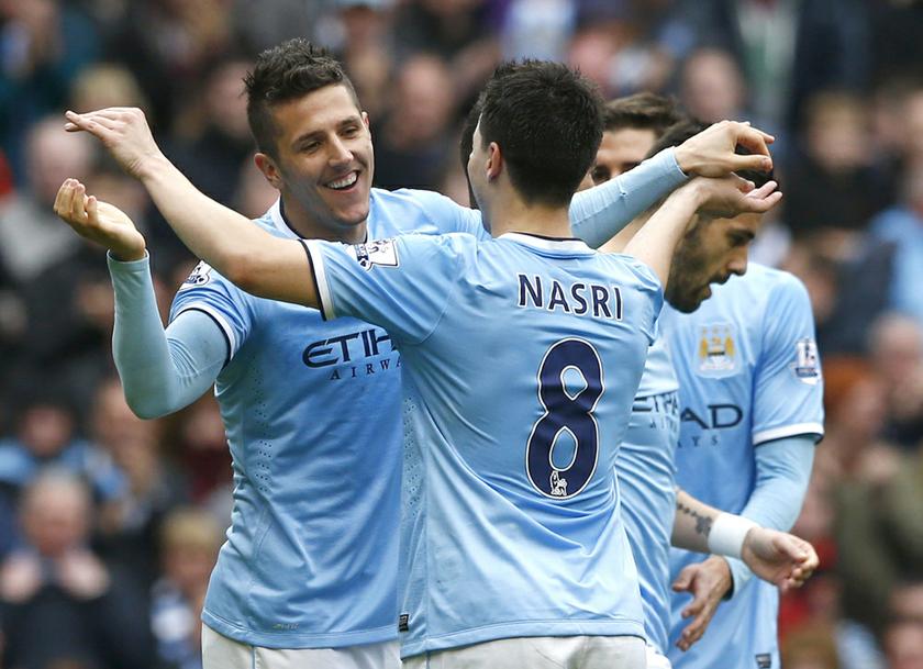 Manchester Cityu00e2u20acu2122s Stevan Jovetic (left) celebrates with team mate Samir Nasri after scoring a goal during their English Premier League soccer match against Southampton at the Etihad stadium in Manchester, northern England, April 5, 2014. u00e2u20acu201d Reuters pic