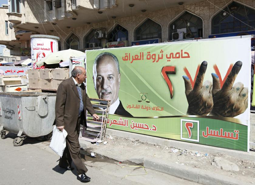 A man looks at an election campaign poster of Iraq's Deputy Prime Minister Hussain al-Shahristani in Baghdad, April 6, 2014. u00e2u20acu201d Reuters pic