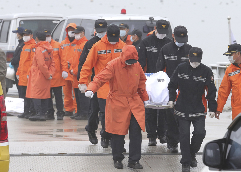 South Korean rescue workers carry the body of a passenger who was on the capsized passenger ship u00e2u20acu02dcSewolu00e2u20acu2122, which sank in the sea off Jindo, April 18, 2014. u00e2u20acu201d Reuters pic