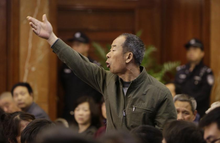 A relative of a passenger aboard Malaysia Airlines flight MH370 gestures as he shouts at Malaysian representatives during a briefing at Lido Hotel in Beijing April 11, 2014. u00e2u20acu201d Reuters pic