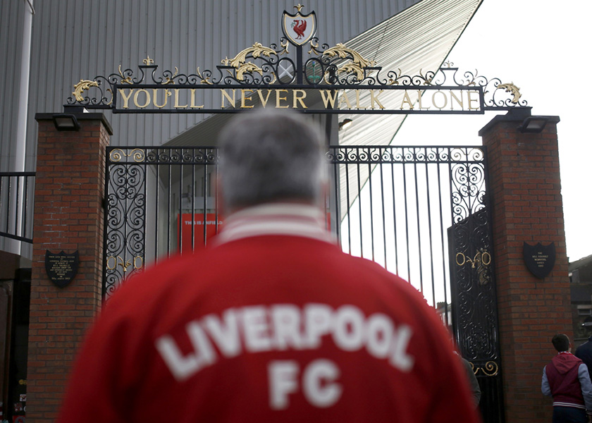 A Liverpool supporter stands in front of the Shankly gates outside Anfield in Liverpool, northern England, March 26, 2014. u00e2u20acu201d Reuters pic