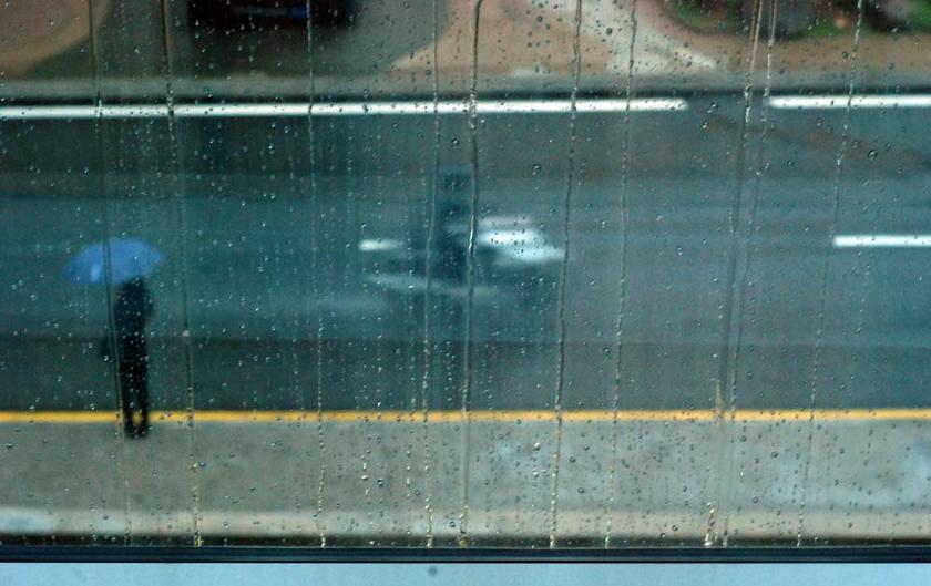 A pedestrian holds on to an umbrella as the Klang Valley has been continuously bombarded with rain over the last few days. u00e2u20acu2022 Picture by Yusof Mat Isa.