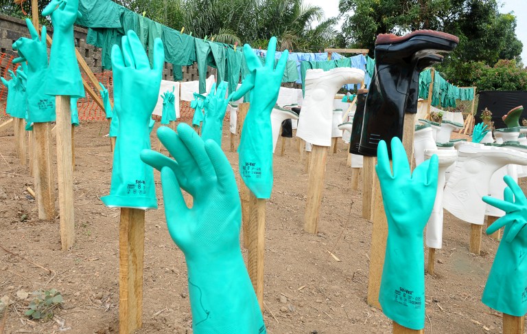 A view of gloves and boots used by medical staff, drying in the sun, at a centre for victims of the Ebola virus in Guekedou, April 4, 2014. u00e2u20acu2022 AFP pic