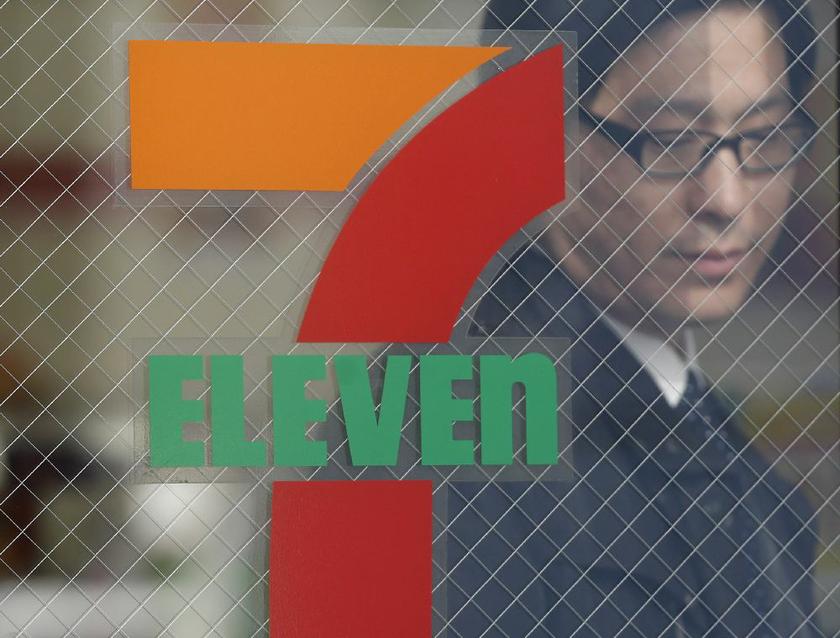 A man walks out from a 7-Eleven convenience store in Tokyo in this January 8, 2013 file photo Reuters