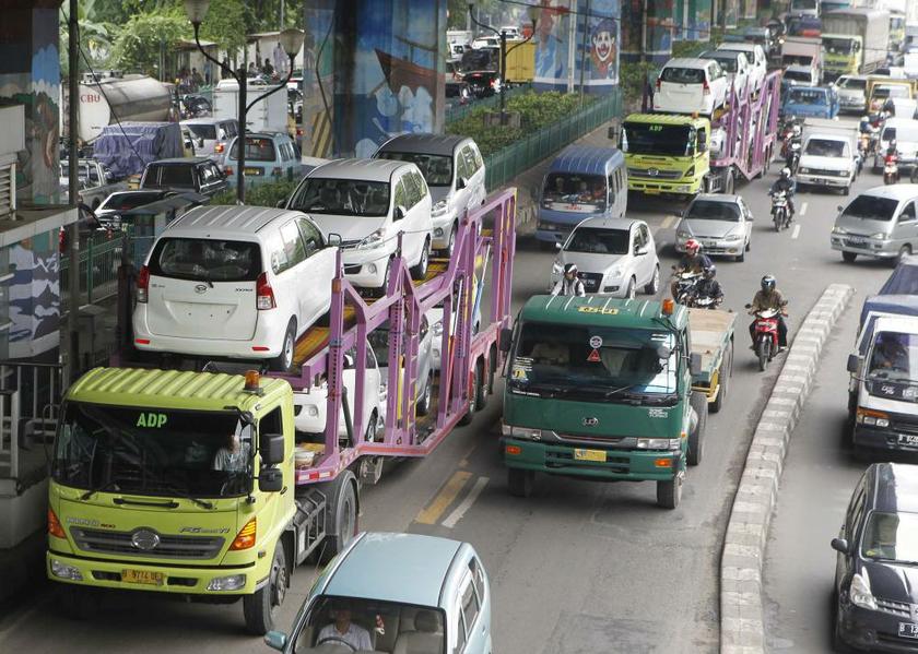 New cars being delivered to dealers in Jakarta January 15, 2013 Reuters