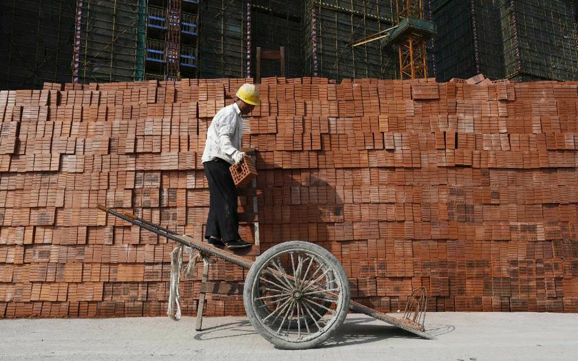 A labourer works at a construction site in Hangzhou, Zhejiang province, April 14, 2014. Chinau00e2u20acu2122s economy grew at its slowest pace in 18 months at the start of 2014 Reuters