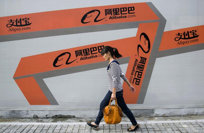 A woman walks past an Alibaba advertisement on a wall in Hangzhou, Zhejiang province, in this file picture taken September 26, 2013. u00e2u20acu201d Reuters pic 
