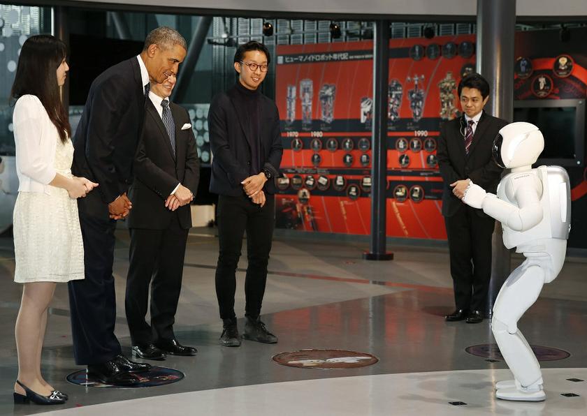 US President Barack Obama (2nd left) bows to 'Asimo' the robot while visiting Miraikan or the National Museum of Emerging Science and Innovation, in Tokyo, April 24, 2014. u00e2u20acu201d Reuters pic