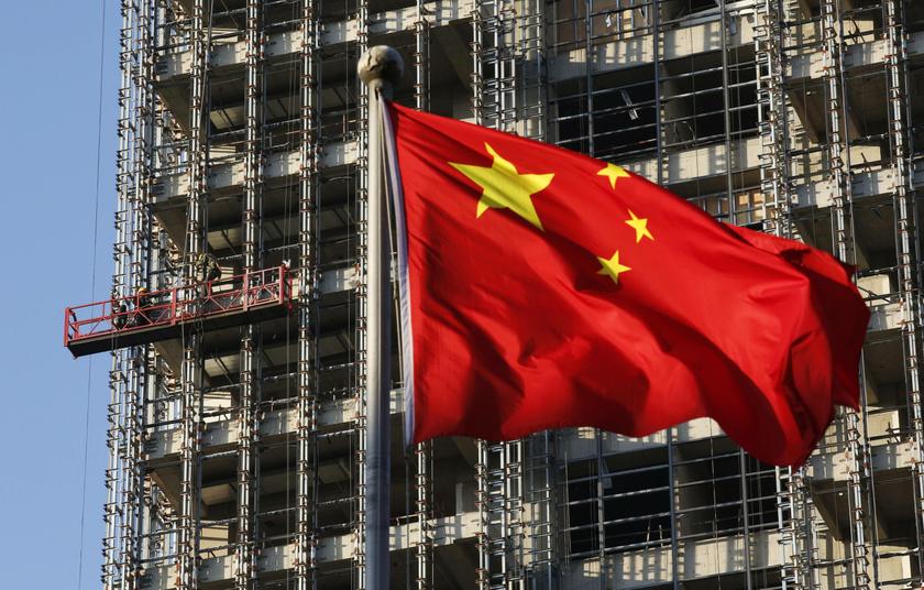A Chinese national flag flutters at a construction site for a new residence complex in Beijing in this November 4, 2013 file photo.  u00e2u20acu201d Reuters pic