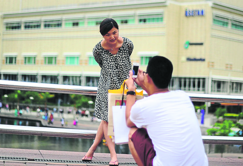 Tourists from China taking pictures at the Kuala Lumpur City Centre, April 12 , 2014. u00e2u20acu201d Picture by Arif Kartono