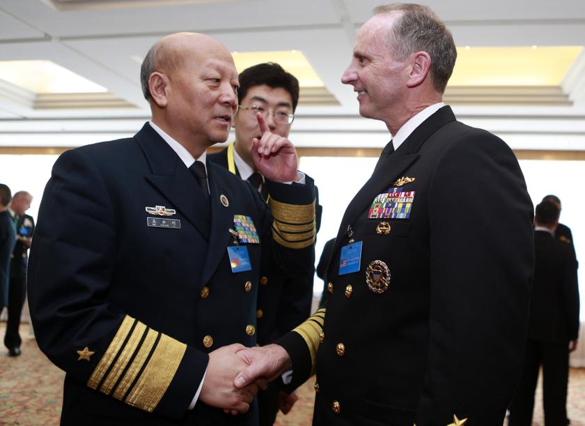 File photo shows Wu Shengli (left), Chinau00e2u20acu2122s commander-in-chief of the Peopleu00e2u20acu2122s Liberation Army Navy, talks with US Admiral Jonathan Greenert, chief of naval operations, during the Western Pacific Naval Symposium in Qingdao, Shandong province April 22,