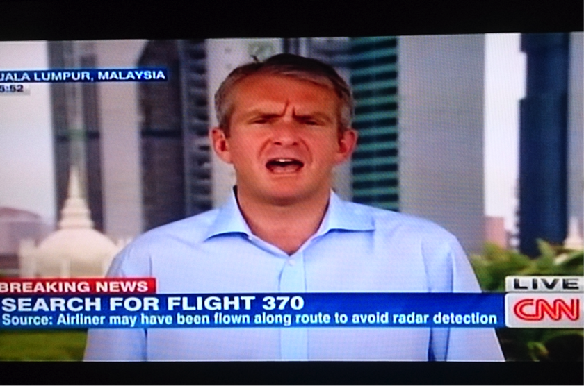 A video-grab shows CNN's senior international correspondent Nick Robertson reporting live from Kuala Lumpur in a breaking news report on MH370.