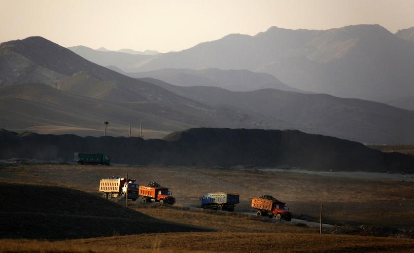 Coal trucks drive along a road leading to a mine located on the outskirts of the city of Baotou, in China's Inner Mongolia Autonomous Region October 31, 2010. u00e2u20acu201d Reuters pic