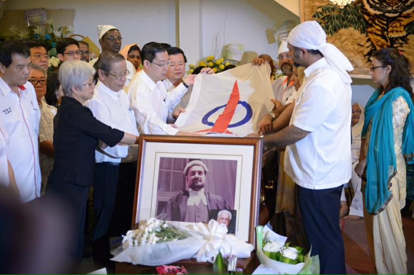 DAP leaders and Karpal Singh's family members put the DAP flag on top the casket at the wake at his home in Penang, April 18,2014. u00e2u20acu201d Picture by K.E. Ooi