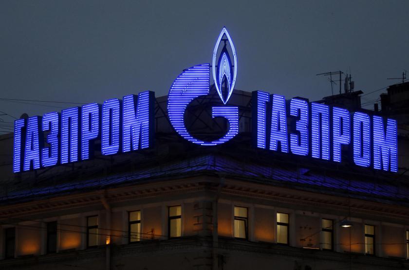 The company logo of Russian natural gas producer Gazprom is seen on an advertisement installed on the roof of a building in St. Petersburg, November 14, 2013. REUTERS