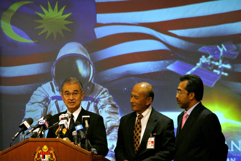 Tun Mohammed Haniff Omar (centre) looks on as former prime minister Tun Abdullah Ahmad Badawi announcese Malaysia's first astronaut in this file pic take in 2007. u00e2u20acu201d Bernama pic