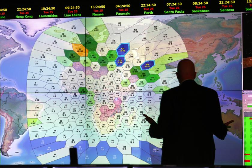 A member of staff at satellite communications company Inmarsat works in front of a screen showing subscribers using their service throughout the world, at their headquarters in London March 25, 2014. u00e2u20acu201d Reuters pic
