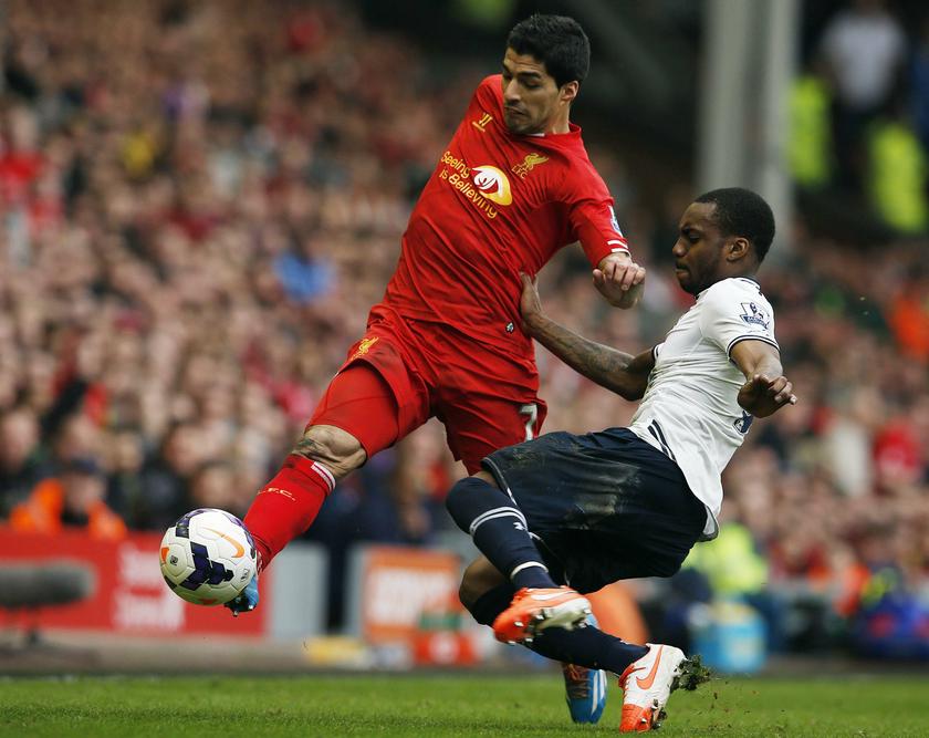 File photo shows Liverpoolu00e2u20acu2122s Luis Suarez (left) challenging Tottenham Hotspuru00e2u20acu2122s Danny Rose during their English Premier League match at Anfield in Liverpool, England March 30, 2014. u00e2u20acu201d Reuters pic