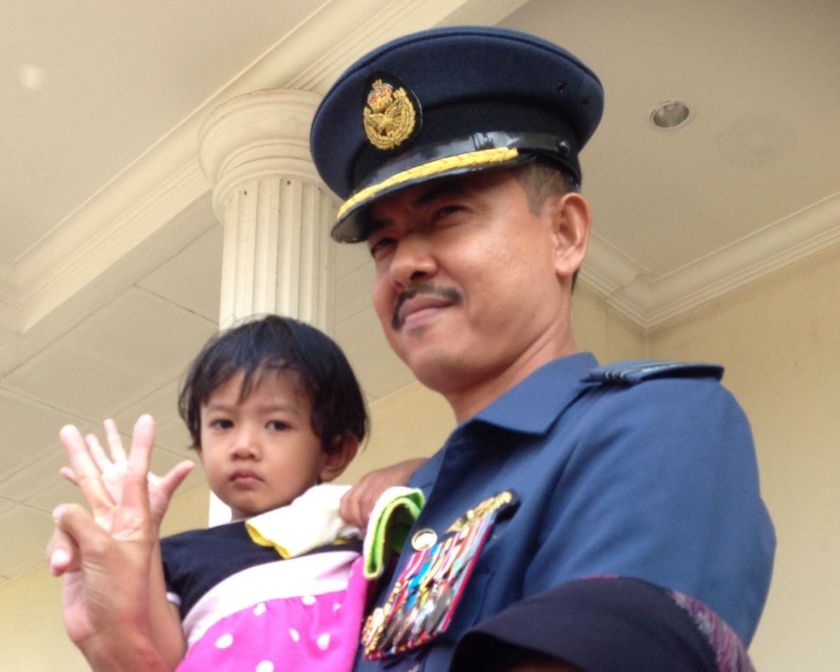 Major Zaidi Ahmad poses with his youngest child outside the Royal Malaysian Air Force (RMAF) military court. u00e2u20acu2022 Picture by Melissa Chi