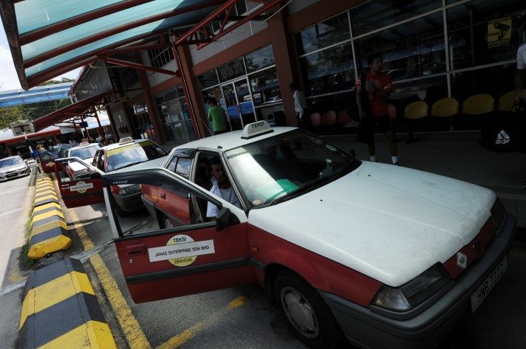 Taxis queue up for passengers at the Duta Bus Terminal in Kuala Lumpur on January 29, 2010. u00e2u20acu2022 AFP pic
