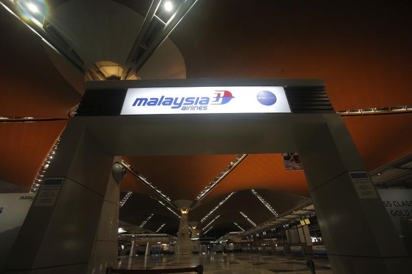 The Malaysia Airlines logo is seen at the main entrance at Kuala Lumpur International Airport in Sepang outside Kuala Lumpur April 21, 2014. u00e2u20acu201d Reuters pic