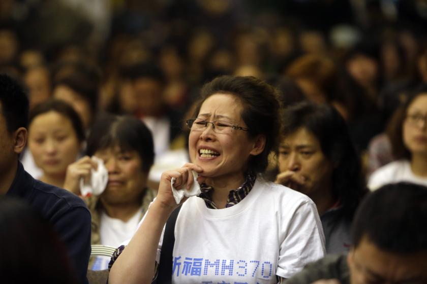 A relative of a passenger aboard Malaysia Airlines flight MH370 gestures as she shouts at Malaysian representatives during a briefing at Lido Hotel in Beijing April 21, 2014. u00e2u20acu201d Reuters pic