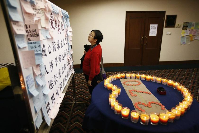 A woman, whose husband was on board Malaysia Airlines MH370, looks at a message board dedicated to the passengers at the Lido Hotel in Beijing April 2, 2014. u00e2u20acu2022 Reuters pic