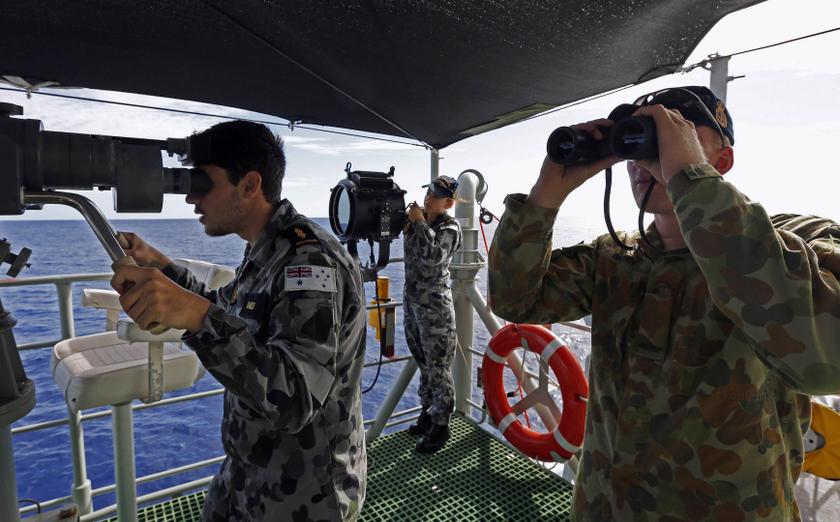 Crew aboard the Australian Navy ship HMAS Perth look towards the HMAS Success during manoeuvres as they continue to search for missing Malaysian Airlines flight MH370 April 10, 2014. u00e2u20acu201d Reuters pic