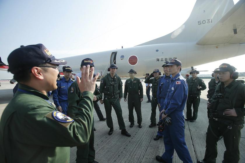Japan Maritime Self-Defense Force P3C crew receive instructions before departing to Pearce Airbase to continue search operations of the missing Malaysia Airlines Flight MH370 at Subang Airbase near Kuala Lumpur April 9, 2014. — Reuters pic