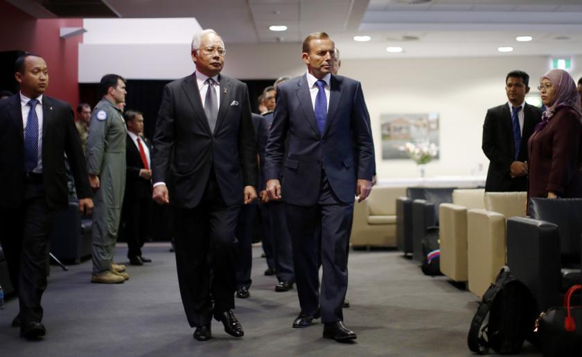 Malaysia's Prime Minister Najib Razak (left) and Australia's Prime Minister Tony Abbott arrive at a briefing on the search for Malaysia Airlines flight MH370 at RAAF Base Pearce near Perth April 3, 2014. u00e2u20acu201d Reuters pic