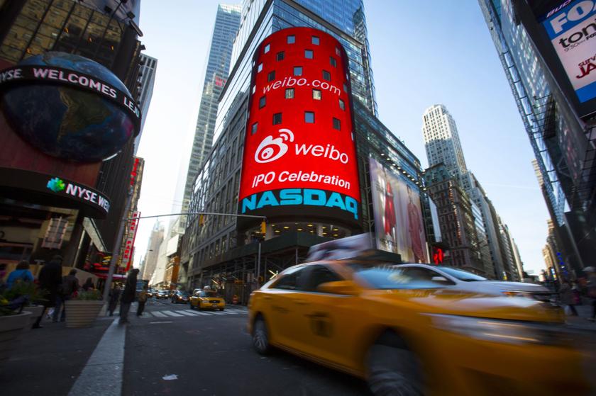 Tech heavyweights Apple and Facebook beat Wall Street expectations and sent stocks up sharply boosting Nasdaq futures. File photo shows the Nasdaq MarketSite in Times Square, New York, in celebration of Weibou00e2u20acu2122s initial public offering (IPO) April 17, 20